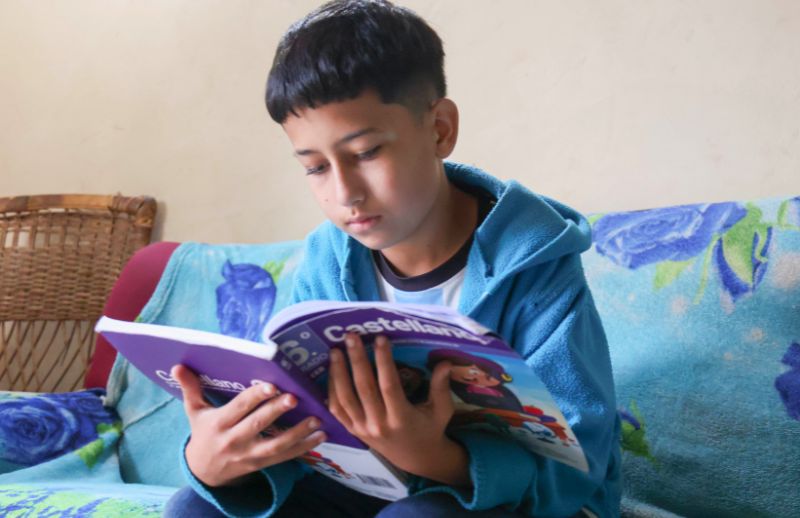 nine-year-old José Miguel reading